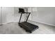 Workout room or home gym space with light gray flooring and plenty of light at 9473 Kings Falls Dr, Charlotte, NC 28210