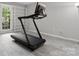Workout room or home gym space with light gray flooring and shelving at 9473 Kings Falls Dr, Charlotte, NC 28210
