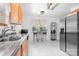 Bright eat-in kitchen featuring marble floors, stainless steel appliances, and a granite countertop at 9716 Psalms St, Cornelius, NC 28031