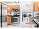 Charming kitchen with stainless steel appliances, granite backsplash and dedicated laundry area at 9716 Psalms St, Cornelius, NC 28031
