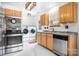 Bright kitchen featuring stainless steel appliances and a washer and dryer at 9716 Psalms St, Cornelius, NC 28031