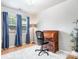Home office with hardwood floors, bright light and modern desk at 9716 Psalms St, Cornelius, NC 28031
