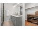 Bathroom featuring dual sinks with marble countertops and grey cabinetry at 1011 Westbrook Dr # A, Charlotte, NC 28202