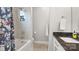 Clean bathroom featuring a shower over tub combination, neutral colors, and granite countertop at 1011 Westbrook Dr # A, Charlotte, NC 28202