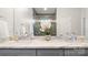 Bathroom with dual marble vanity tops and an elegant glass shower enclosure at 1011 Westbrook Dr # A, Charlotte, NC 28202