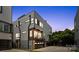 Modern three-story home with sleek gray siding, balconies, and a two-car garage, set against a twilight sky at 1011 Westbrook Dr # A, Charlotte, NC 28202