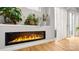 Modern linear fireplace adds warmth and elegance to the living space with hardwood floors at 1011 Westbrook Dr # A, Charlotte, NC 28202
