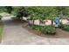 A tranquil community garden path featuring benches, lush greenery, and a memorial garden at 1011 Westbrook Dr # A, Charlotte, NC 28202