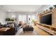 Cozy living room showcasing hardwood floors, comfortable seating, and a stylish media center at 1011 Westbrook Dr # A, Charlotte, NC 28202