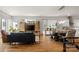 Open-concept living room featuring hardwood floors, modern furniture, and ample natural light at 1011 Westbrook Dr # A, Charlotte, NC 28202