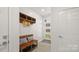 Functional mudroom with bench, storage, and access to the front door at 1011 Westbrook Dr # A, Charlotte, NC 28202
