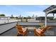 Rooftop deck with comfortable chairs and fire pit overlooking city skyline at 1011 Westbrook Dr # A, Charlotte, NC 28202