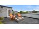 Relaxing rooftop deck features a fire pit, comfortable rocking chairs, and scenic outdoor space at 1011 Westbrook Dr # A, Charlotte, NC 28202