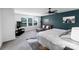 Comfortable bedroom features a ceiling fan, television and large windows with outside view at 1019 Beacon Ave, Monroe, NC 28110