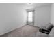 Cozy bedroom with neutral walls and carpeting, filled with natural light at 1019 Beacon Ave, Monroe, NC 28110