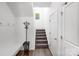 Clean entryway featuring a coat rack, bench, and staircase at 1019 Beacon Ave, Monroe, NC 28110