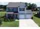 Charming two-story home with a two-car garage, well-maintained lawn, and beautiful landscaping at 1019 Beacon Ave, Monroe, NC 28110