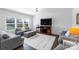 Cozy living room featuring a large window, television, and comfortable seating at 1019 Beacon Ave, Monroe, NC 28110