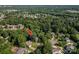 Aerial shot of a home nestled among lush trees in a residential neighborhood at 10925 Lassen Ct, Charlotte, NC 28214