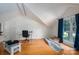Bonus room featuring hardwood floors, desk, and large windows at 10925 Lassen Ct, Charlotte, NC 28214