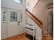 Bright foyer with hardwood floors, staircase, and convenient storage console at 10925 Lassen Ct, Charlotte, NC 28214