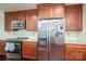 Kitchen boasts stainless steel refrigerator, oven, microwave, and ample cabinetry at 10925 Lassen Ct, Charlotte, NC 28214