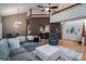 Spacious living room features high ceilings, a gray sectional, and an open layout great for entertaining at 10925 Lassen Ct, Charlotte, NC 28214