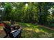 Spacious backyard with a fire pit and wooded views at 126 Doyle Farm Ln, Mooresville, NC 28115