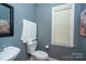 Powder room with gray walls, a corner sink, and natural light at 126 Doyle Farm Ln, Mooresville, NC 28115