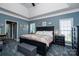 A primary bedroom boasts high ceilings, a sitting area, and natural lighting at 126 Doyle Farm Ln, Mooresville, NC 28115