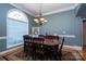 Elegant dining room with large window and traditional chandelier at 126 Doyle Farm Ln, Mooresville, NC 28115