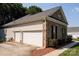 Spacious two-car garage with brick and vinyl siding at 126 Doyle Farm Ln, Mooresville, NC 28115