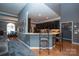 This modern kitchen features stylish bar seating and open access to the dining area at 126 Doyle Farm Ln, Mooresville, NC 28115