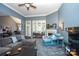 Comfortable living room with fireplace, large windows, and neutral color palette at 126 Doyle Farm Ln, Mooresville, NC 28115