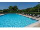 A refreshing swimming pool surrounded by lounge chairs offers a perfect spot for relaxation and recreation at 126 Doyle Farm Ln, Mooresville, NC 28115
