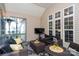 Covered porch with outdoor seating and a large flatscreen television at 126 Doyle Farm Ln, Mooresville, NC 28115