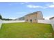 Expansive backyard with lush grass and a privacy fence at 128 Cherry Birch St, Mooresville, NC 28117