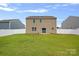 Expansive backyard with lush grass and a privacy fence at 128 Cherry Birch St, Mooresville, NC 28117