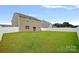 Expansive backyard with lush green grass and a privacy fence at 128 Cherry Birch St, Mooresville, NC 28117