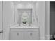 Modern bathroom featuring double sinks, white cabinets, and glass shower at 128 Cherry Birch St, Mooresville, NC 28117