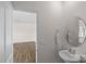 Neat half bathroom featuring a pedestal sink and modern fixtures at 128 Cherry Birch St, Mooresville, NC 28117