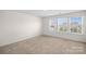 Bedroom with three windows and carpet at 128 Cherry Birch St, Mooresville, NC 28117