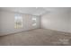 Bedroom with carpet and 2 bright windows at 128 Cherry Birch St, Mooresville, NC 28117