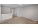 Bright bonus room with neutral carpet at 128 Cherry Birch St, Mooresville, NC 28117