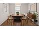 Modern dining room with stylish furnishings, wood floors, and elegant decor at 128 Cherry Birch St, Mooresville, NC 28117