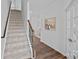 Inviting hallway with hardwood floors and stairway at 128 Cherry Birch St, Mooresville, NC 28117