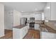 Well-lit kitchen boasting stainless steel appliances, white cabinetry, and granite countertops at 128 Cherry Birch St, Mooresville, NC 28117