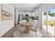 Eat-in kitchen featuring stainless steel appliances and modern dining set at 128 Cherry Birch St, Mooresville, NC 28117