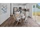 Eat-in kitchen features a round table with seating, modern cabinetry, and sliding glass doors to the outside at 128 Cherry Birch St, Mooresville, NC 28117