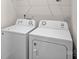 This laundry area features a modern white washing machine and dryer set at 128 Cherry Birch St, Mooresville, NC 28117